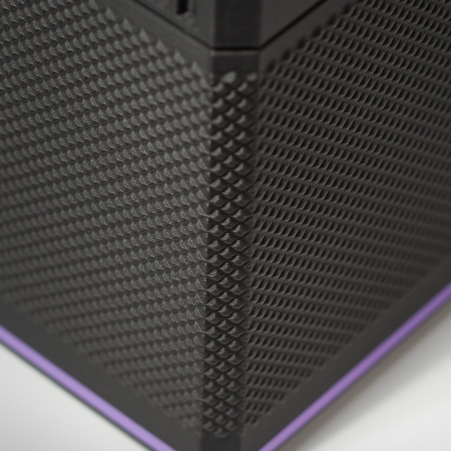 Close-up of the textured grip on the Sonar Purple MTG Commander deck box